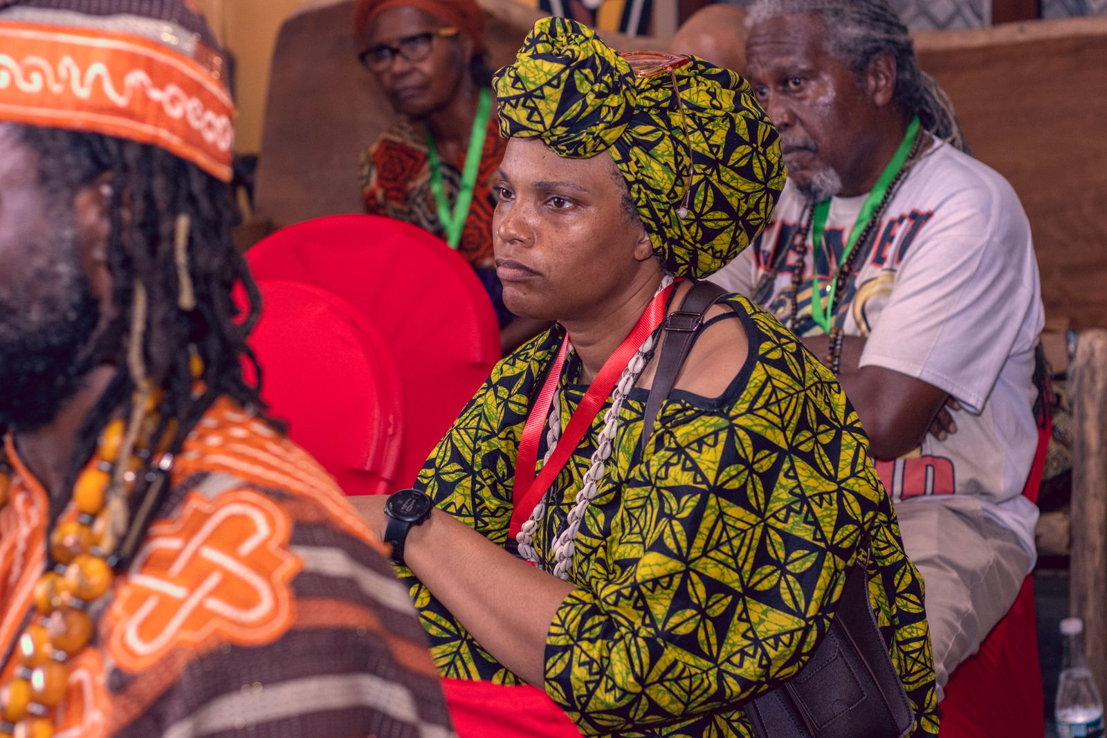 Sankɔfa Journey participants listening during a gathering in Ghana
